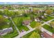 Aerial view showcasing a home with a lush green lawn and mature trees at 417 W Ash St, Jamestown, IN 46147