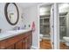 Bathroom featuring wood cabinets, a large sink, and a separate shower room at 417 W Ash St, Jamestown, IN 46147