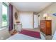 Bright bedroom with a large window, neutral tones, and ample storage space with closet at 417 W Ash St, Jamestown, IN 46147