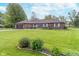 Well-kept lawn and landscaping complement this brick ranch home's welcoming exterior at 417 W Ash St, Jamestown, IN 46147
