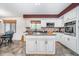 Bright kitchen with white cabinets, stainless steel appliances, and center island at 417 W Ash St, Jamestown, IN 46147