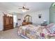 Spacious main bedroom with a ceiling fan, dresser with vanity, and soft, neutral tones at 417 W Ash St, Jamestown, IN 46147