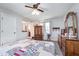 Bright main bedroom features neutral wall paint, a ceiling fan, carpet, and furniture at 417 W Ash St, Jamestown, IN 46147