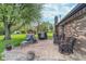 Brick patio with wicker seating and a view of the spacious yard at 417 W Ash St, Jamestown, IN 46147