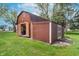 Brown backyard barn shed with open doors at 417 W Ash St, Jamestown, IN 46147