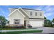 Charming two-story home with a welcoming front porch, two-car garage, and beautifully landscaped yard at 4340 Pine Bluff Dr, Bargersville, IN 46106