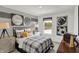 A beautifully decorated bedroom with sports-themed decor, a cozy bed, and natural light from the window at 4348 Pine Bluff Dr, Bargersville, IN 46106