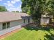 Aerial of backyard featuring a small patio area, shed, and ample grassy space, perfect for outdoor activities at 4611 29Th St, Columbus, IN 47203