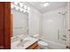 Well-lit bathroom with a single vanity, shower-tub combo, and a mirrored medicine cabinet at 4611 29Th St, Columbus, IN 47203