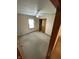 Bedroom with neutral carpet, a ceiling fan and good light from the windows at 4611 29Th St, Columbus, IN 47203
