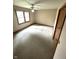 Bedroom with neutral carpet, a ceiling fan and good light from the windows at 4611 29Th St, Columbus, IN 47203