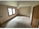 Bedroom with neutral carpet, a ceiling fan and good light from the windows at 4611 29Th St, Columbus, IN 47203