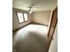 Bedroom with neutral carpet, a ceiling fan and good light from the windows at 4611 29Th St, Columbus, IN 47203