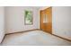 Bedroom with carpeted floors, closet and lots of natural light at 4611 29Th St, Columbus, IN 47203