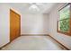 Bright bedroom with carpet, window, closet, and ceiling fan at 4611 29Th St, Columbus, IN 47203