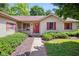 Charming home featuring a well-manicured lawn and a red front door at 4611 29Th St, Columbus, IN 47203