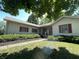 Traditional home with a covered front porch, shutters, landscaping, and green lawn at 4611 29Th St, Columbus, IN 47203