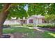 A beautiful home with red shutters and lush landscaping at 4611 29Th St, Columbus, IN 47203
