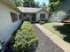 Traditional home with a covered front porch, shutters, landscaping, and green lawn at 4611 29Th St, Columbus, IN 47203