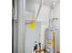 Basement utility area featuring a modern furnace and water heater for the home at 4611 29Th St, Columbus, IN 47203