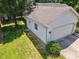 Rear aerial view showcasing an attached garage with easy access to yard and a well-kept lawn area at 4611 29Th St, Columbus, IN 47203