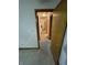 The hallway is carpeted and provides passage to other rooms at 4611 29Th St, Columbus, IN 47203