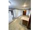 Eat-in kitchen with floral wallpaper border, cream cabinets, and tiled floor at 4611 29Th St, Columbus, IN 47203
