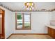 Bright kitchen area with a large window offering a view to the neighborhood and natural light at 4611 29Th St, Columbus, IN 47203