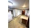 Eat-in kitchen with floral wallpaper border, cream cabinets, and tiled floor at 4611 29Th St, Columbus, IN 47203
