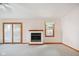 Bright living room features a fireplace, ceiling fan and sliding glass doors for natural light at 4611 29Th St, Columbus, IN 47203