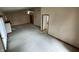 Open living room with vaulted ceilings, fireplace, ceiling fan, and carpet flooring at 4611 29Th St, Columbus, IN 47203