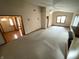 Spacious living room featuring vaulted ceiling, ceiling fan and carpet at 4611 29Th St, Columbus, IN 47203