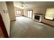 Spacious living room features a fireplace, ceiling fan, and natural light at 4611 29Th St, Columbus, IN 47203