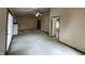 Open living room with vaulted ceilings, fireplace, ceiling fan, and carpet flooring at 4611 29Th St, Columbus, IN 47203