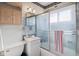 Cozy bathroom featuring a shower-tub combo with sliding glass doors at 4864 N Katherine Dr, Indianapolis, IN 46226