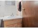 Bathroom with wooden vanity and updated fixtures, complete with a towel rack at 4864 N Katherine Dr, Indianapolis, IN 46226