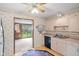 Kitchen displaying white cabinetry, a view into the living room, and standard appliances at 4864 N Katherine Dr, Indianapolis, IN 46226