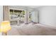 Bright living room featuring a large window overlooking the front yard, with neutral carpet at 4864 N Katherine Dr, Indianapolis, IN 46226