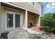 Cozy back patio with sliding glass door and partially covered area perfect for outdoor enjoyment at 5177 Fairway Dr, Avon, IN 46123