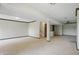 Unfinished basement with neutral carpet and wood trim at 5177 Fairway Dr, Avon, IN 46123