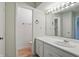 Bathroom vanity featuring a sink and a large mirror at 5177 Fairway Dr, Avon, IN 46123