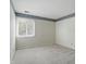 Bright bedroom with large window and neutral carpet at 5177 Fairway Dr, Avon, IN 46123