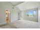 Bedroom with vaulted ceilings, a window, and door to exterior at 5177 Fairway Dr, Avon, IN 46123