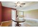 Spacious dining room with wood flooring, ceiling fan, and natural light at 5177 Fairway Dr, Avon, IN 46123