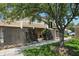 Two-story townhouse with brown siding and a mature tree casting shade on the lawn at 5177 Fairway Dr, Avon, IN 46123
