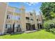 Multi-level townhome featuring private balconies, a well-manicured lawn and mature trees at 5177 Fairway Dr, Avon, IN 46123
