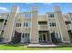 Back of building showcasing the multi-story exterior with private balconies offering outdoor enjoyment at 5177 Fairway Dr, Avon, IN 46123