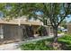Charming exterior view with well-kept lawn, mature tree, and privacy fence with a pedestrian access gate at 5177 Fairway Dr, Avon, IN 46123