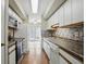 Efficient kitchen with essential appliances, ample cabinets, and natural light, perfect for cooking and casual dining at 5177 Fairway Dr, Avon, IN 46123