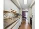 Kitchen with stainless steel appliances, white cabinets, and decorative backsplash at 5177 Fairway Dr, Avon, IN 46123